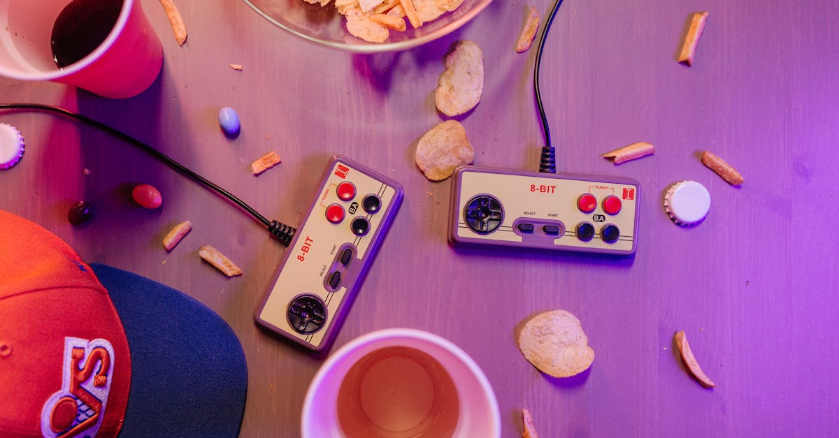 gaming controllers and retro game box art on a sleek table