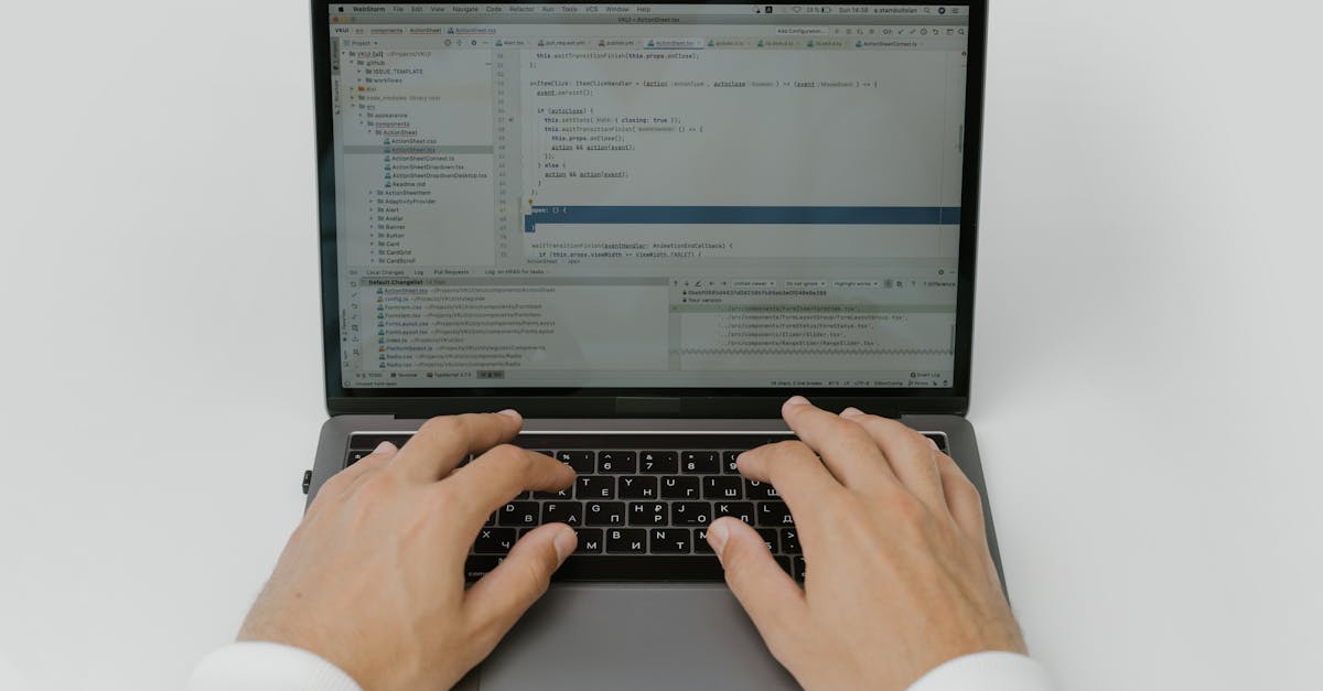 software engineer hesitating before clicking install button on laptop