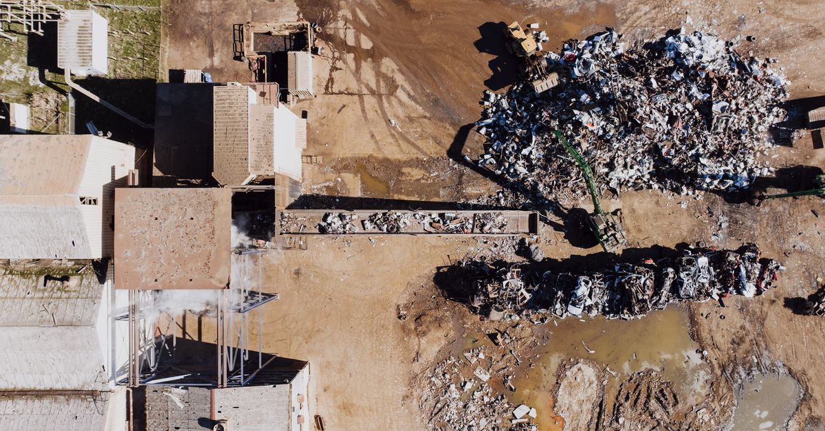 Ford factory with Redwood Materials recycling plant, industrial background