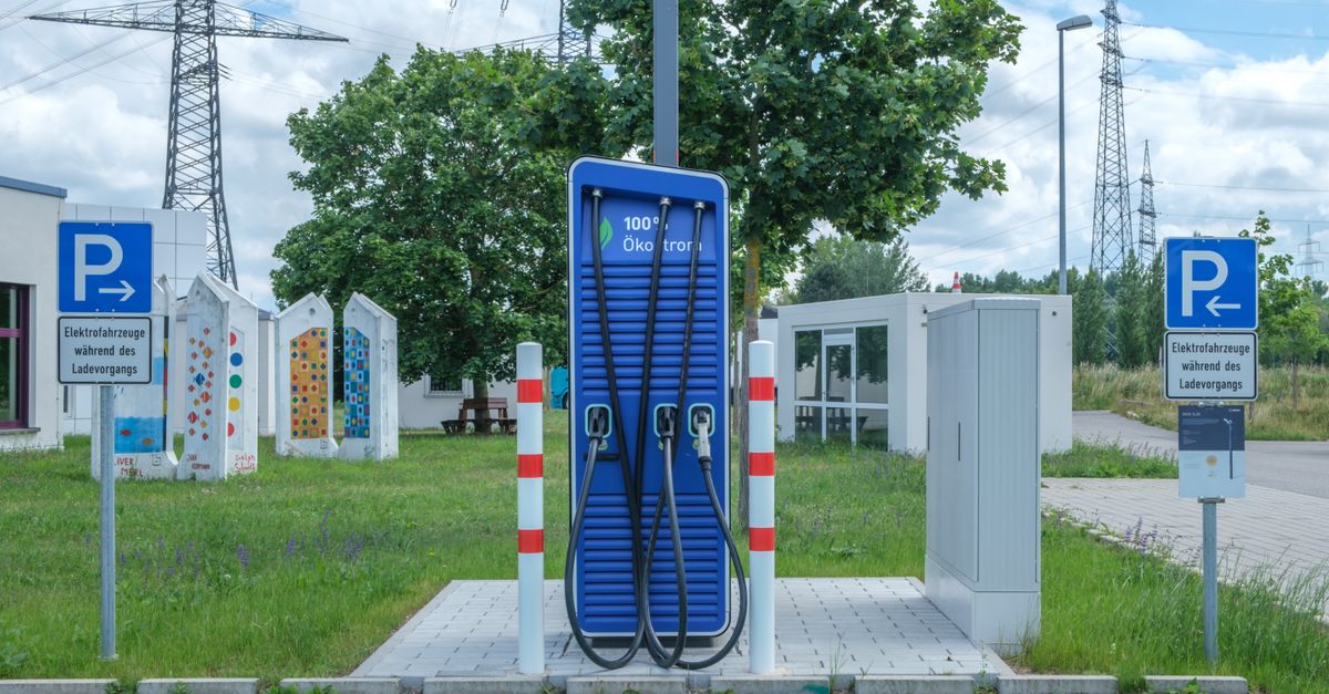 nighttime autonomous vehicle charging station on a quiet residential street