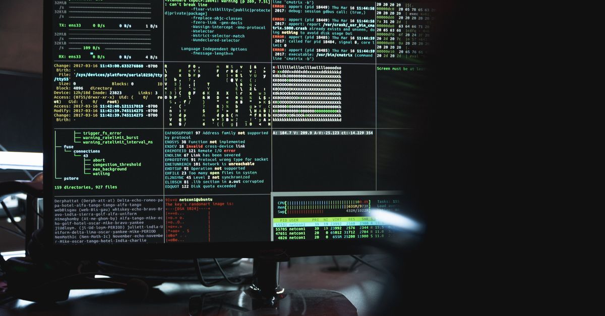engineer debugging code on a terminal with server racks