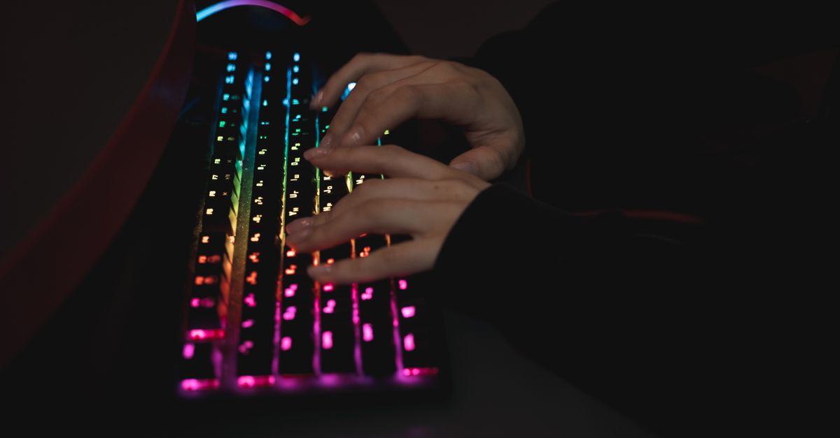 ultraportable gaming laptop on a desk with glowing keyboard