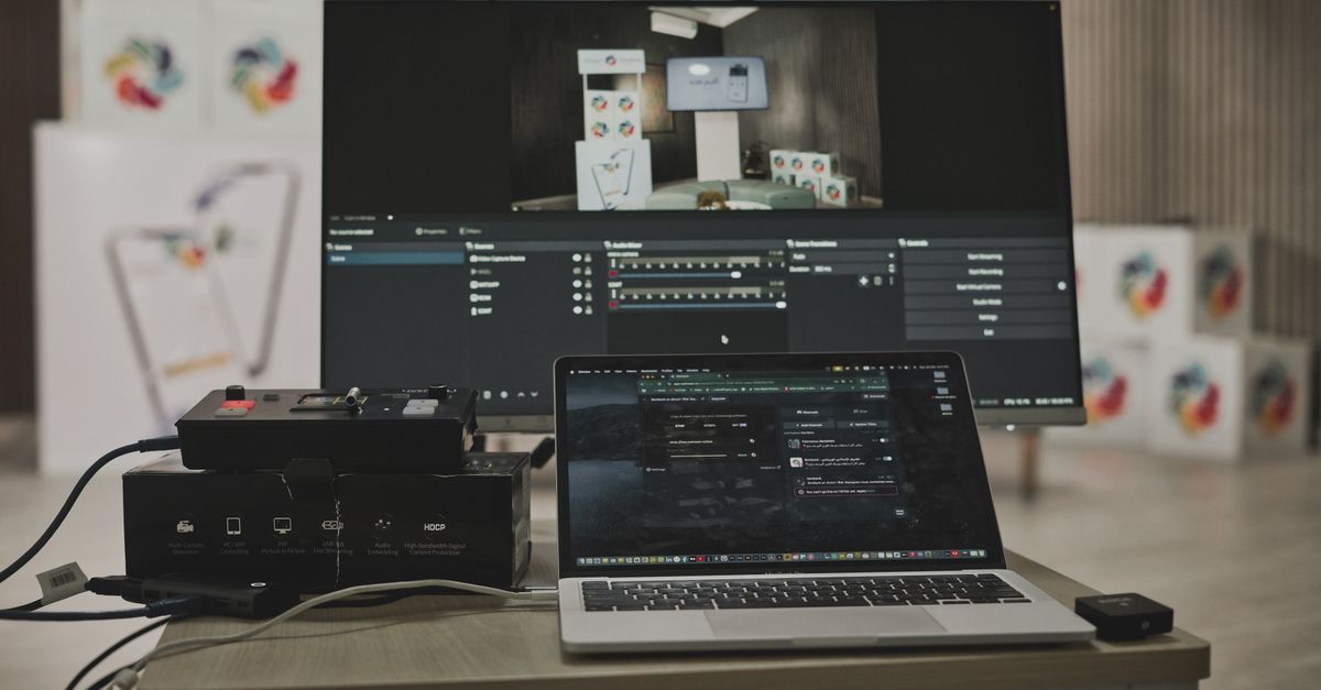 engineer connecting phone to laptop with USB cable, laptop screen showing SQLite terminal