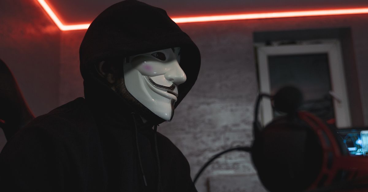 shadowy figure in a dim server room with glowing code streams