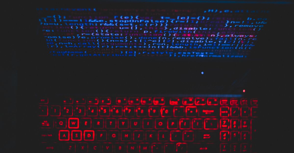 laptop screen showing AI code and performance metrics
