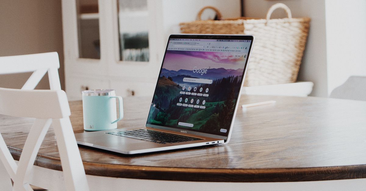a sleek laptop with a Snapdragon X2 chip displaying a Linux terminal beside a Chrome browser window