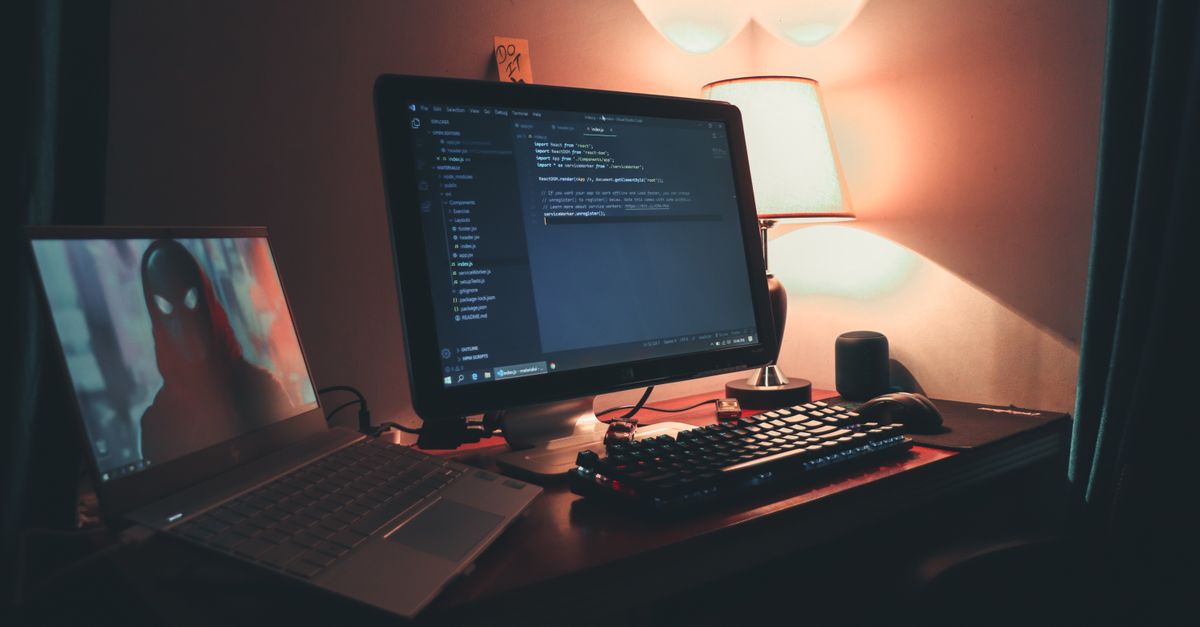 PC monitor displaying a PS5 game alongside Linux terminal code