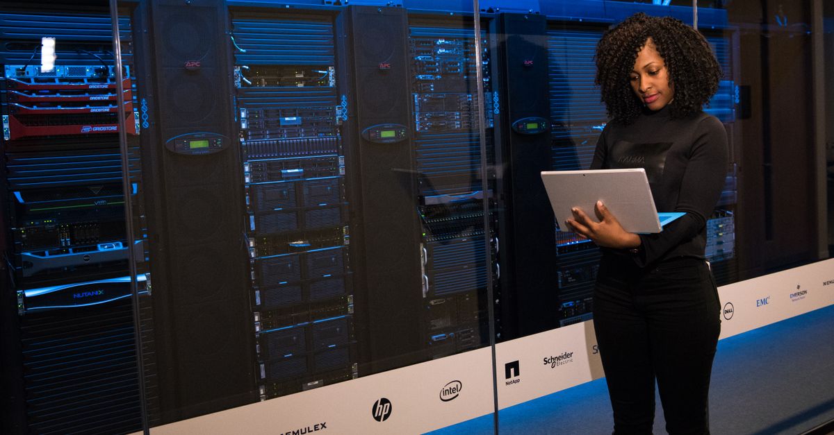 government server racks with cloud icons and facial recognition camera overlay