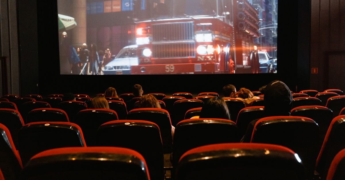 IMAX theater interior with a Formula 1 car projected on the screen