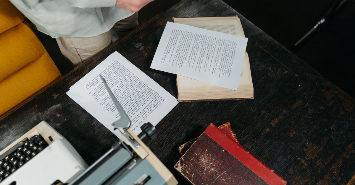 a frustrated editor surrounded by AI-generated manuscript pages