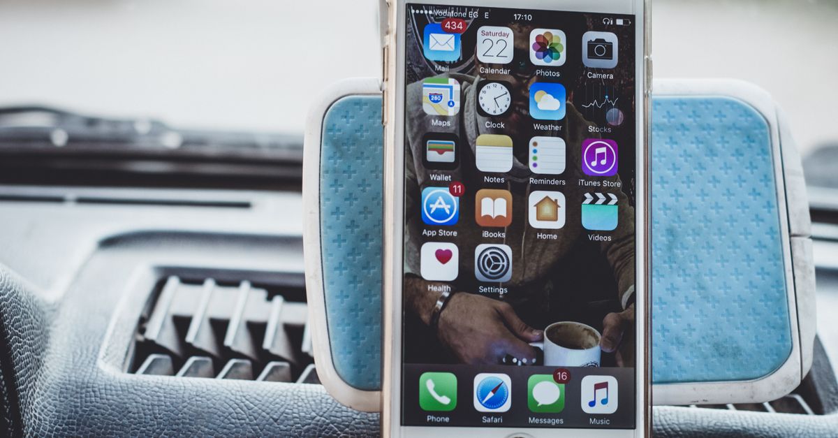 a data center juxtaposed with a redwood forest and a flip phone beside a modern car dashboard