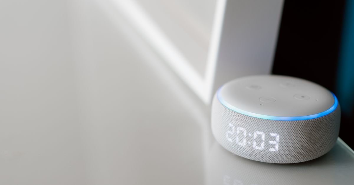 a sleek voice assistant device with waveform overlay