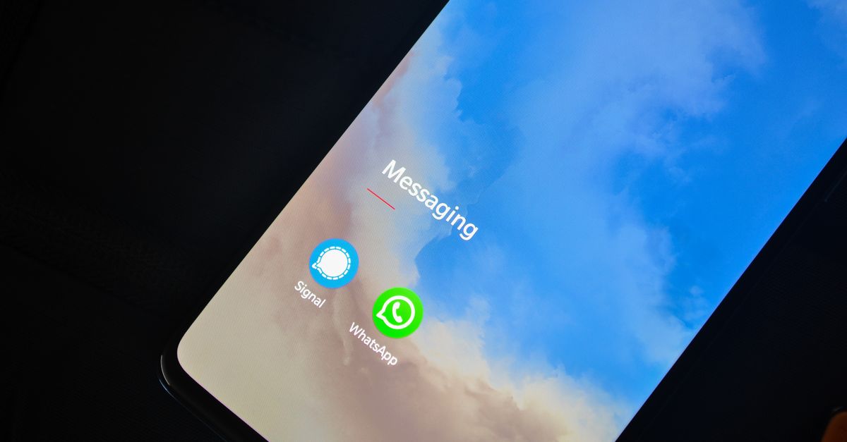 Android smartphone displaying Messages app with a security shield overlay