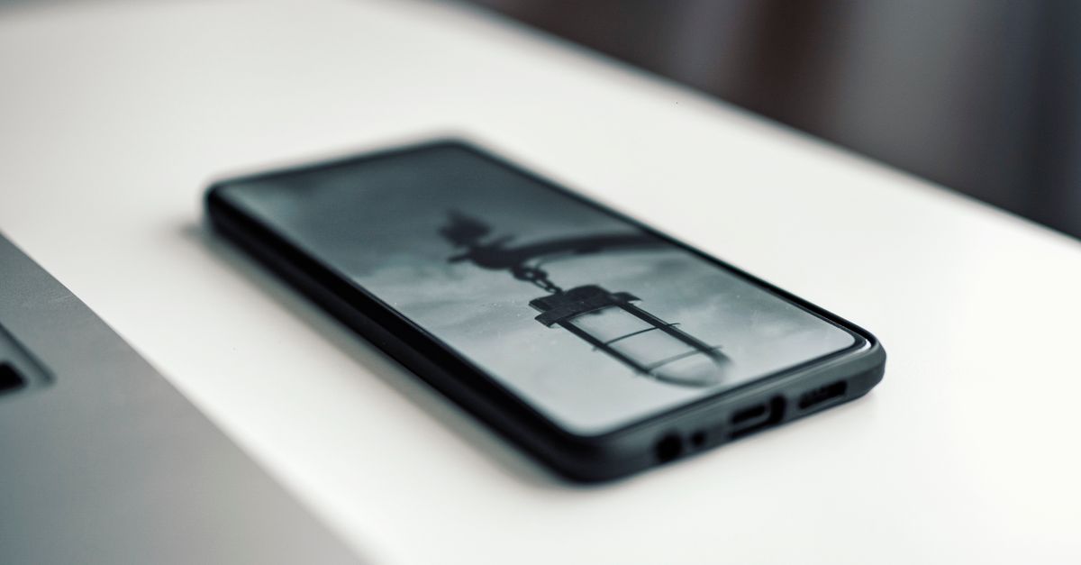 foldable smartphone with sleek hinge on a modern desk